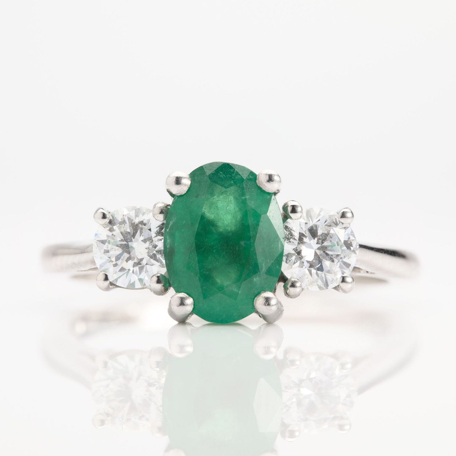 Platinum Oval Cut Emerald & Round Brilliant Cut Diamond Trilogy Ring