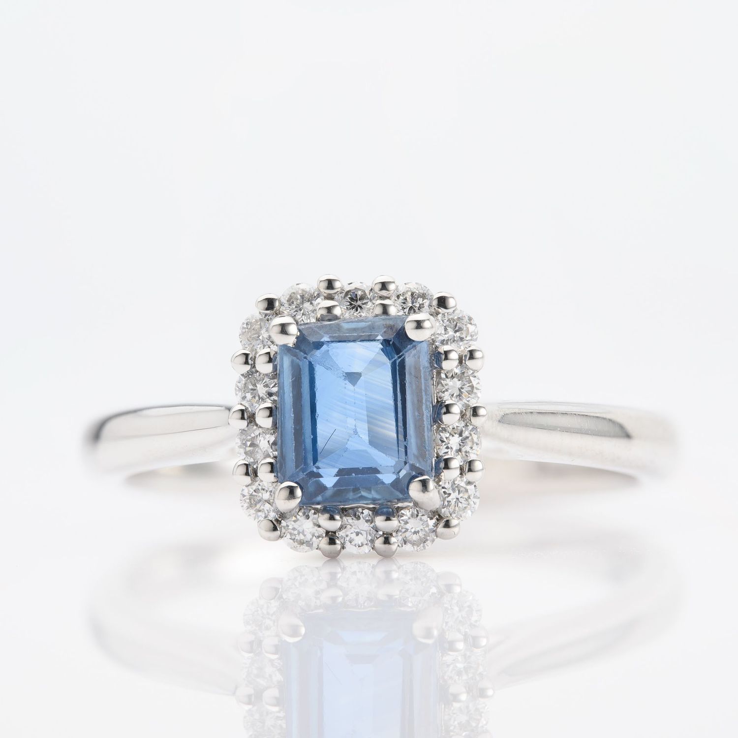Platinum Octagonal Cut Sapphire & Round Brilliant Cut Diamond Halo Cluster Ring