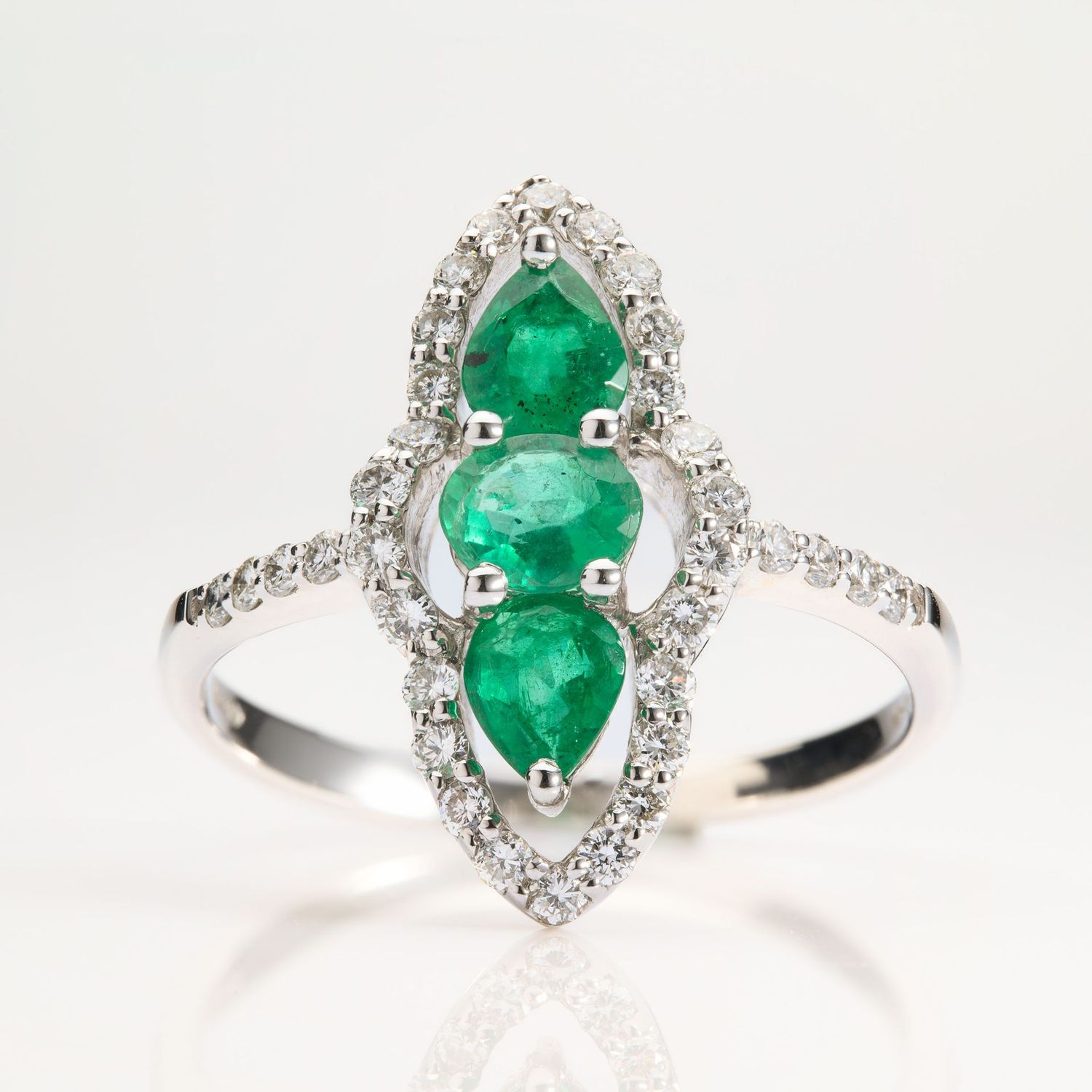 18ct White Gold Marquise Shaped Emerald & Diamond Triple Halo ring