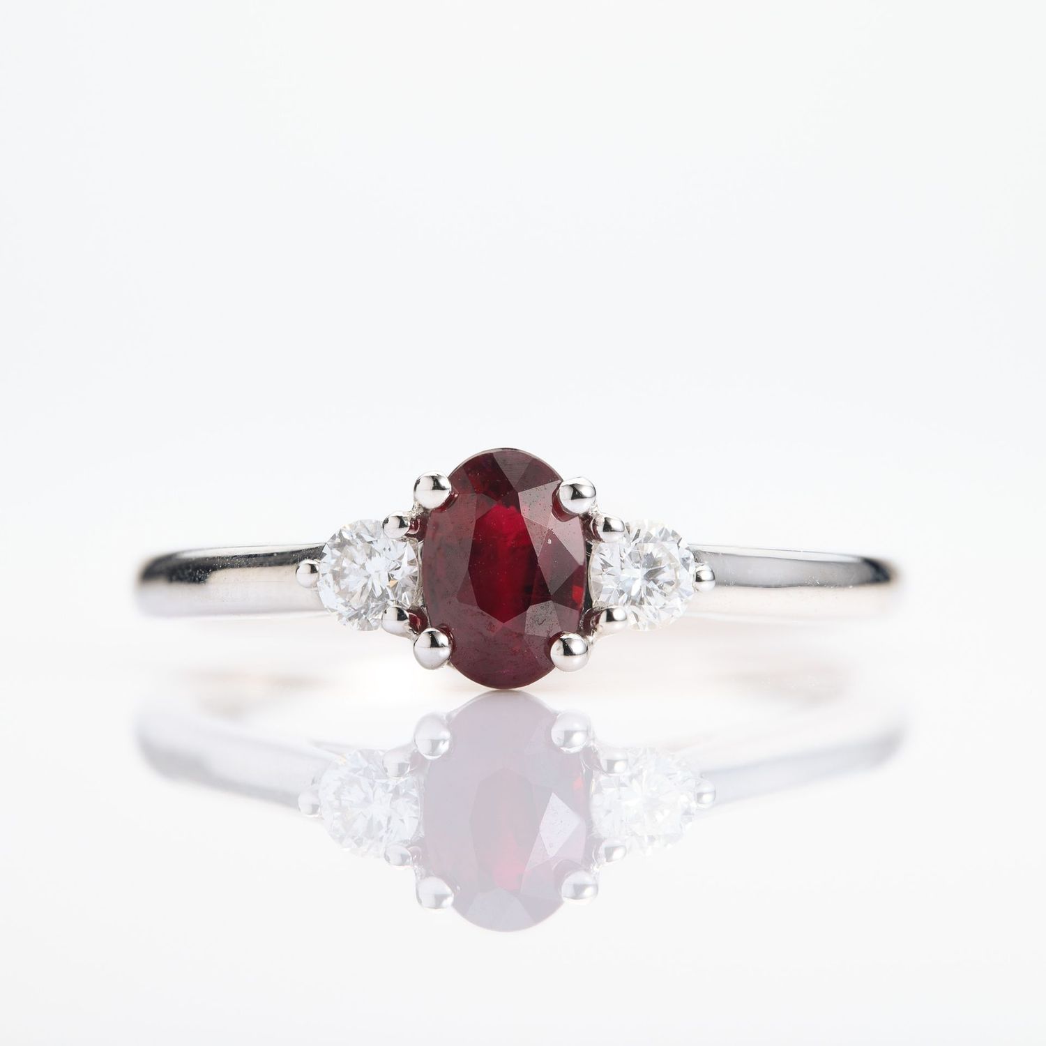 Platinum Oval Cut Ruby & Round Brilliant Cut Diamond Trilogy Ring