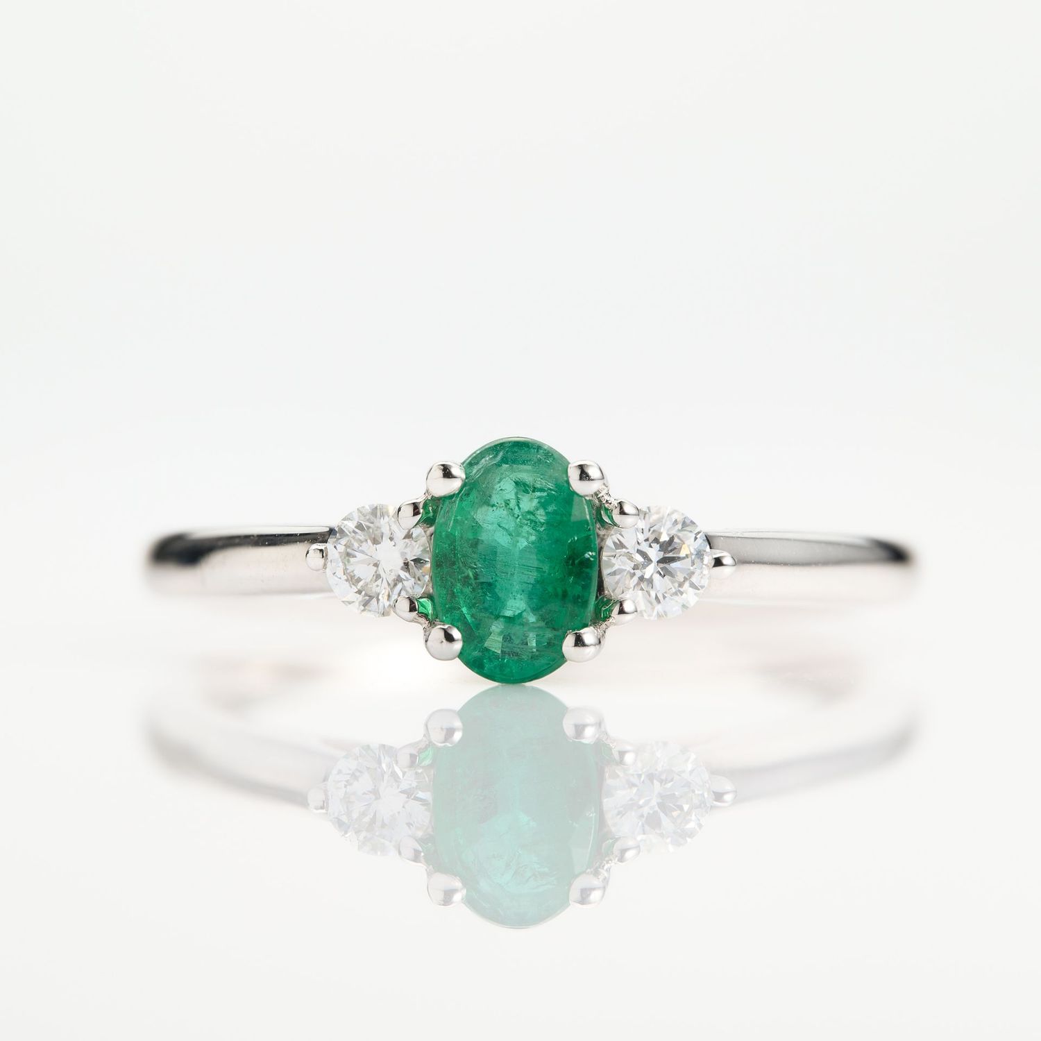 Platinum Oval Cut Emerald & Round Brilliant Cut Diamond Trilogy Ring