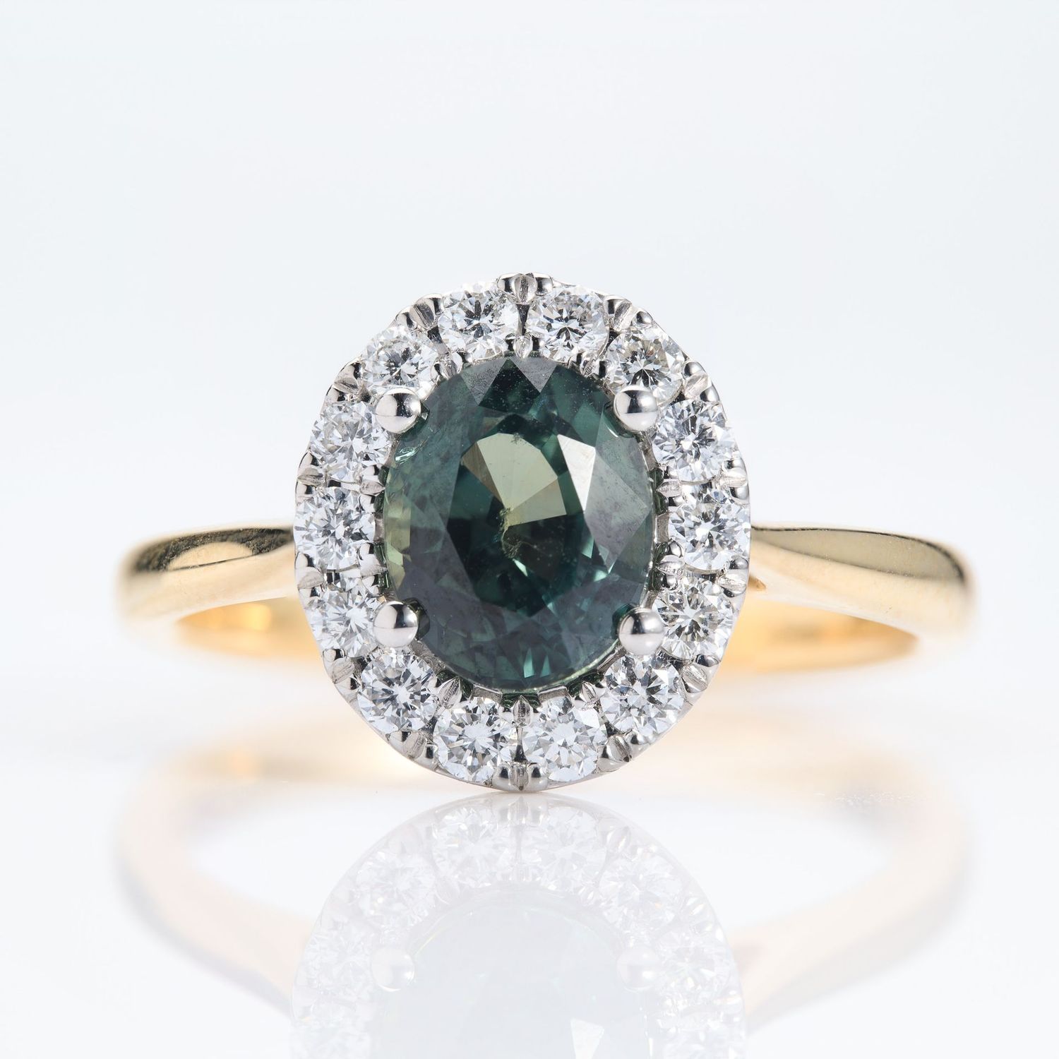 18ct Yellow Gold & Platinum Oval Cut Teal Green Sapphire & Round Brilliant Cut Diamond Halo Cluster Ring