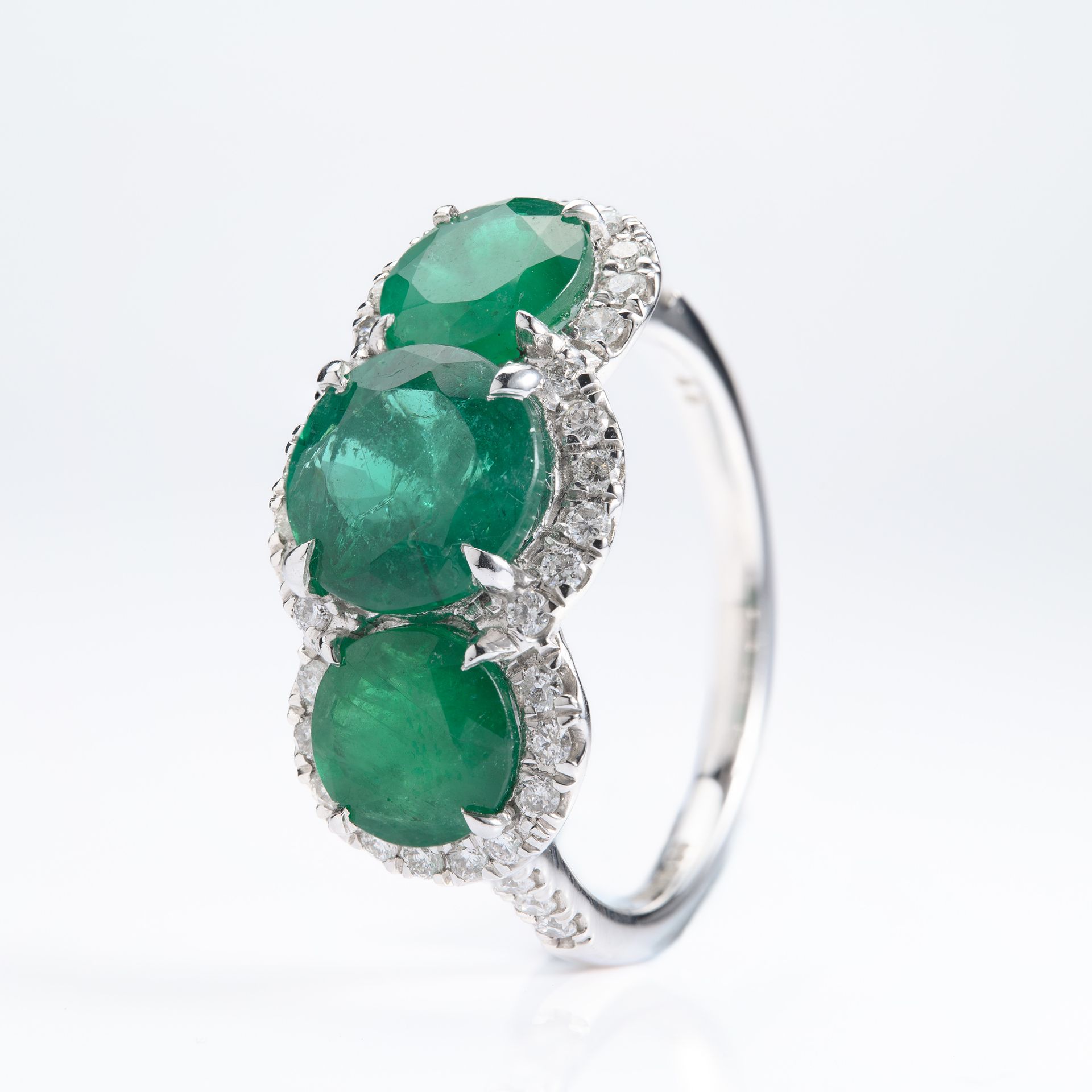 Platinum Round Cut Emerald & Round Brilliant Cut Diamond Triple Halo Cluster Ring
