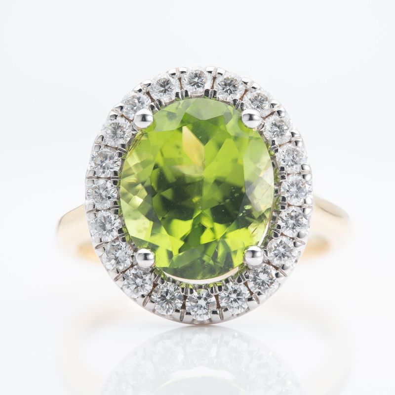 18ct Gold Oval Cut Peridot & Round Brilliant Cut Diamond Halo Cluster Ring