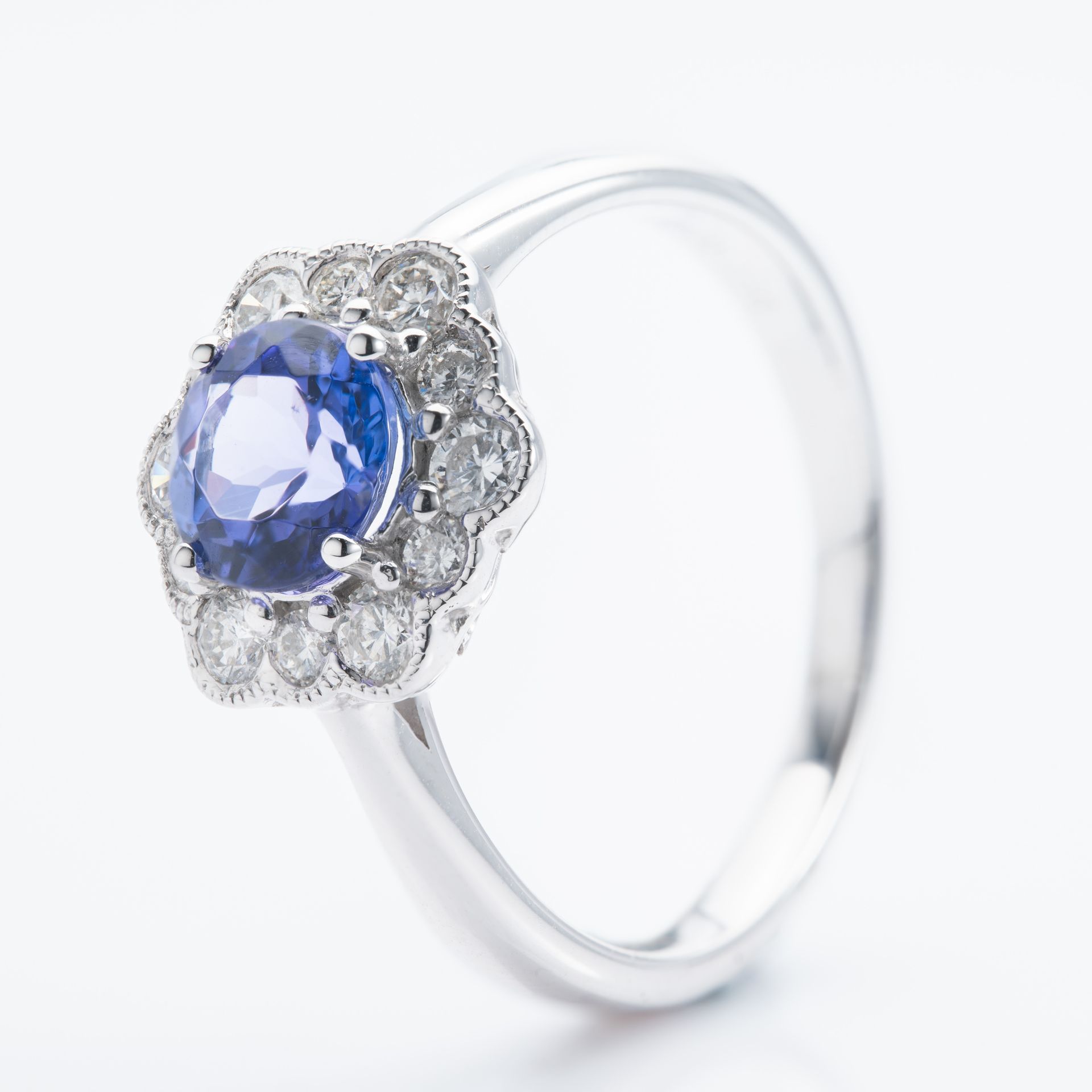 Platinum Round Cut Tanzanite & Round Brilliant Cut Diamond Cluster Ring