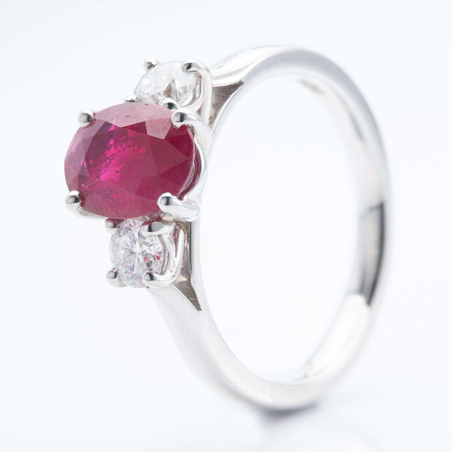 Platinum Oval Cut Ruby and Round Brilliant Cut Diamond Trilogy Ring