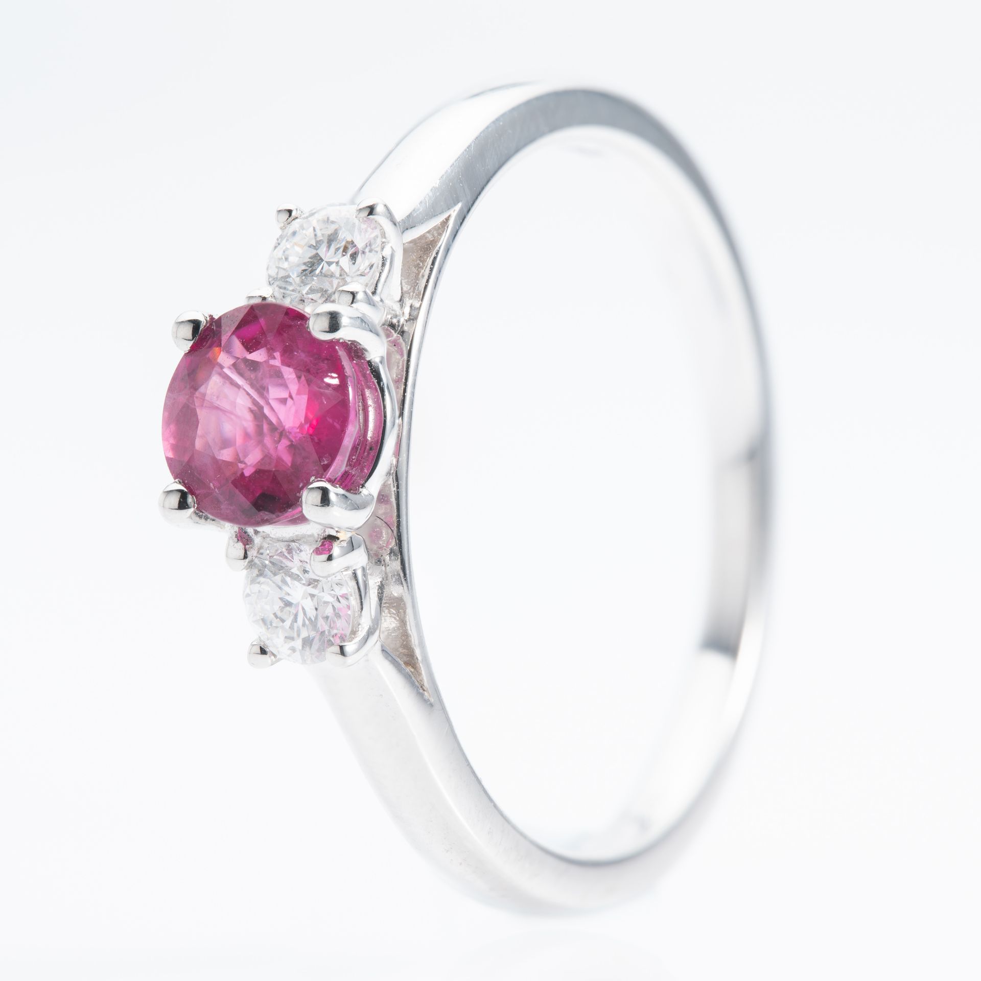 Platinum Round Cut Ruby and Brilliant Cut Diamond Trilogy Ring