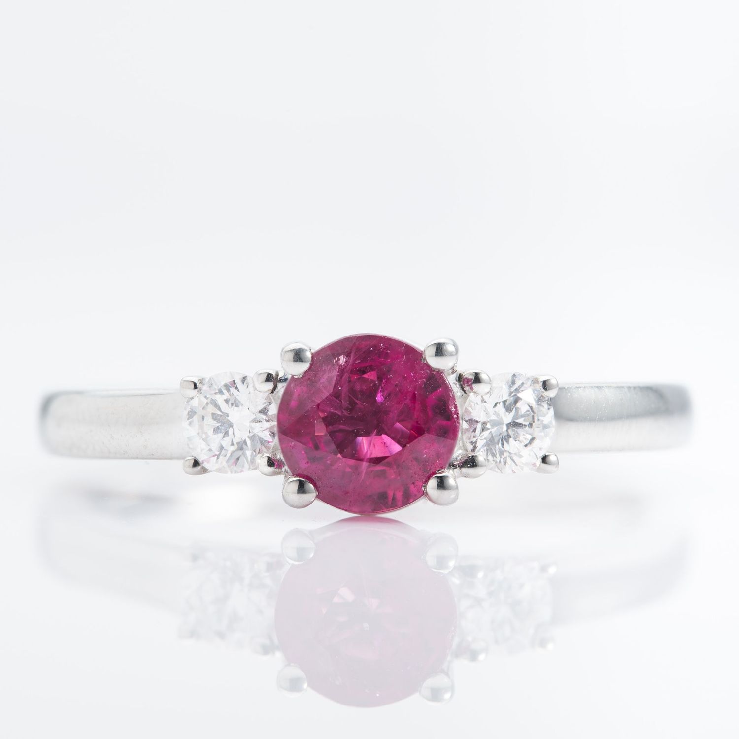Platinum Round Cut Ruby and Brilliant Cut Diamond Trilogy Ring