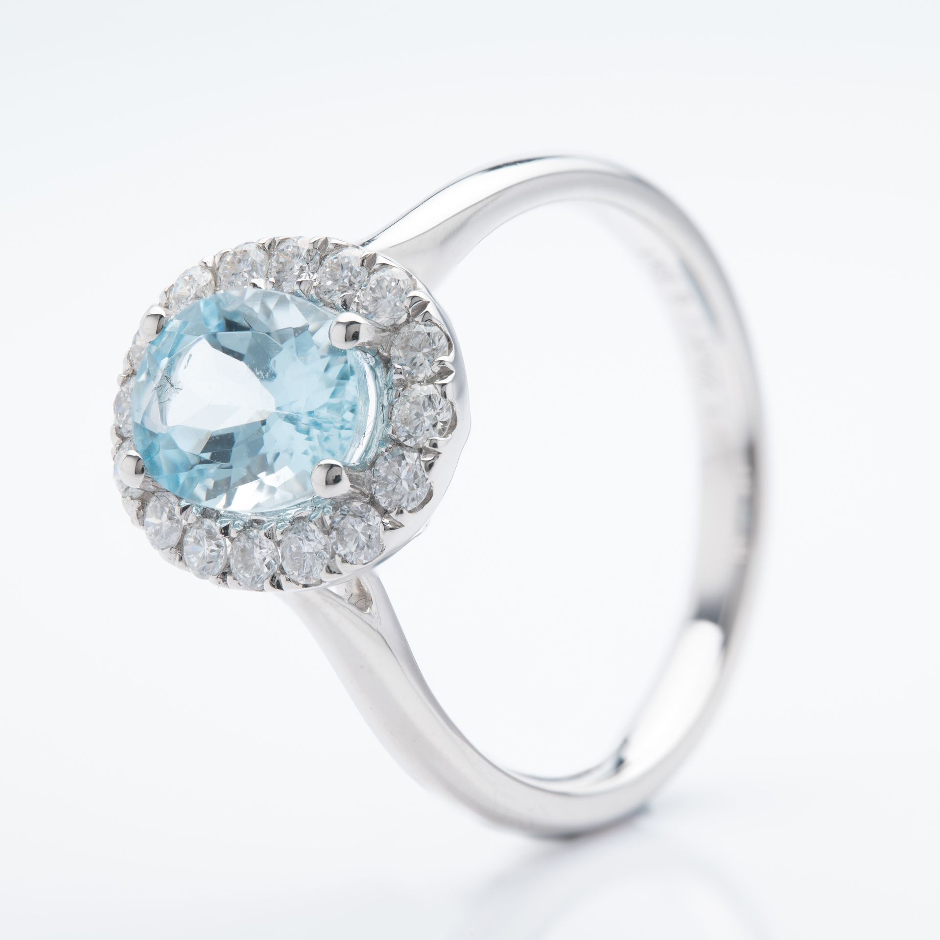 Platinum Oval Cut Aquamarine and Brilliant Cut Diamond Cluster Ring