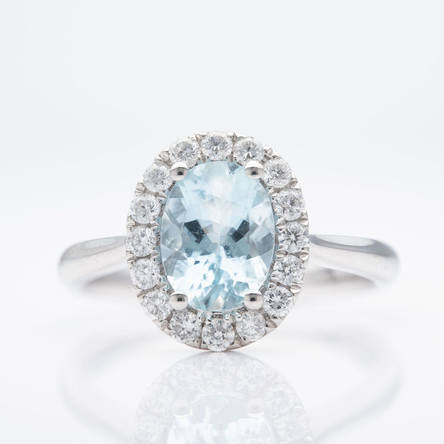 Platinum Oval Cut Aquamarine and Brilliant Cut Diamond Cluster Ring
