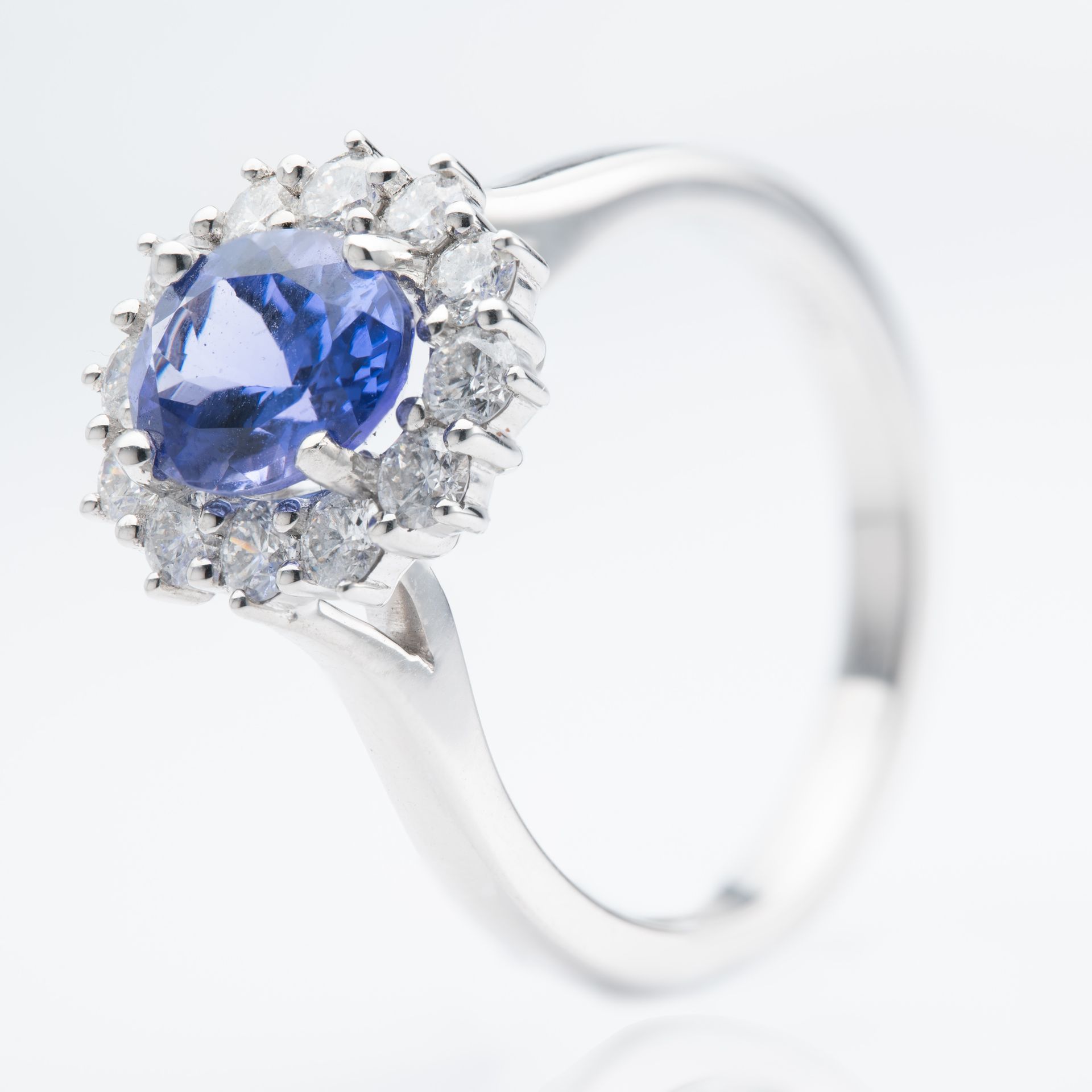 Platinum Oval Cut Tanzanite & Round Brilliant Cut Diamond Cluster Ring