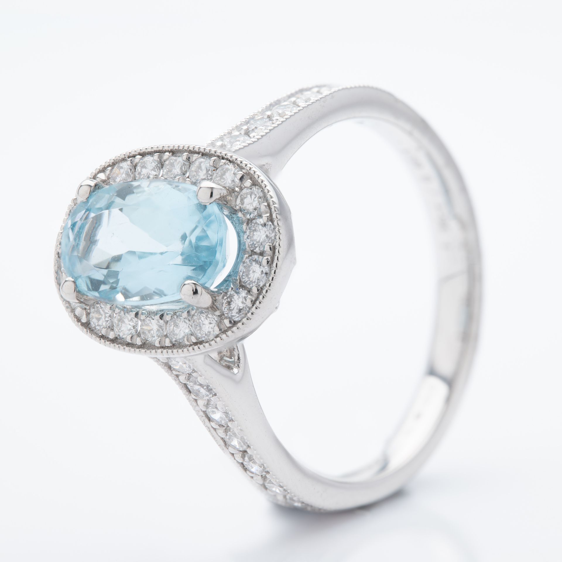 Platinum Oval Cut Aquamarine and Brilliant Round Cut Diamond Cluster Ring
