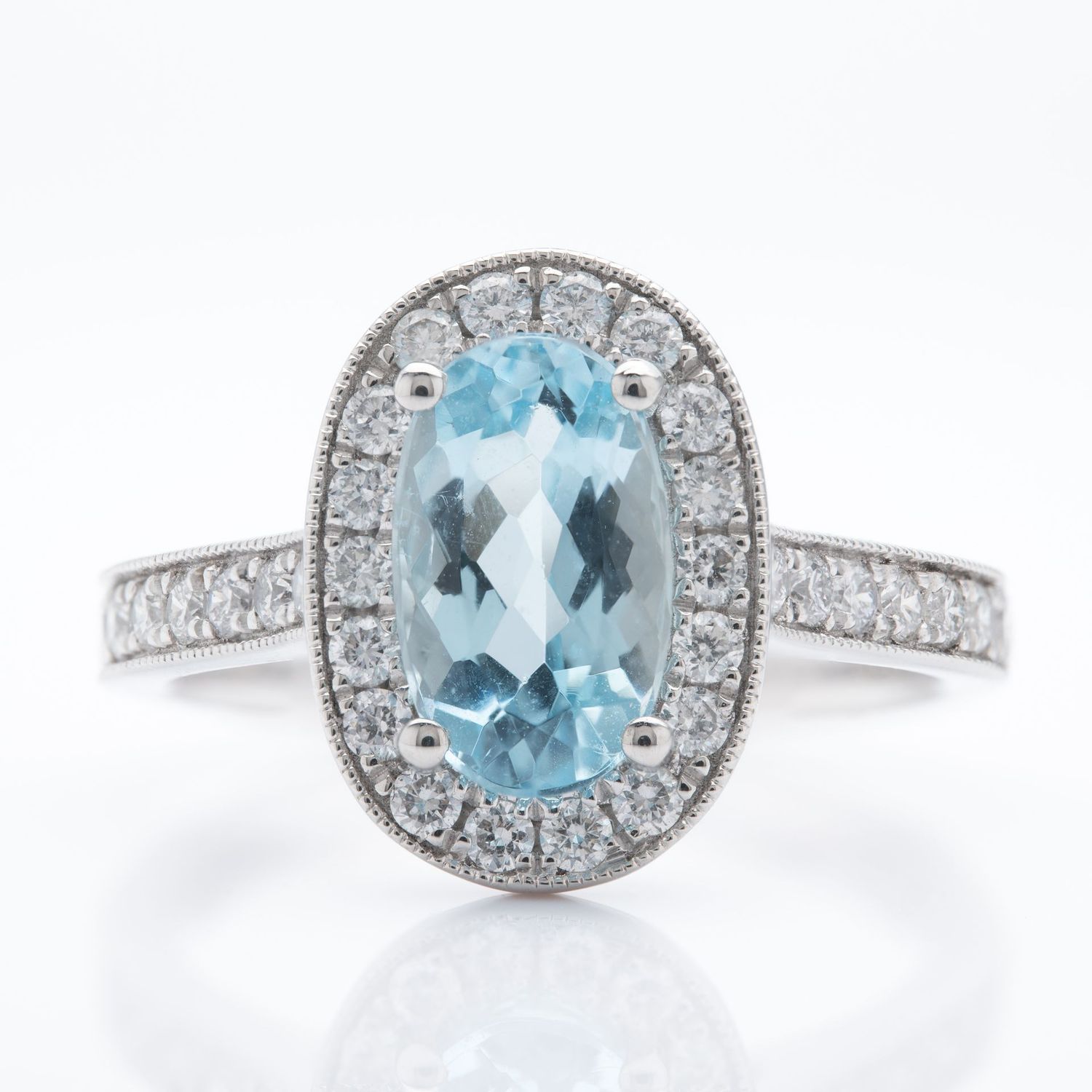 Platinum Oval Cut Aquamarine and Brilliant Round Cut Diamond Cluster Ring
