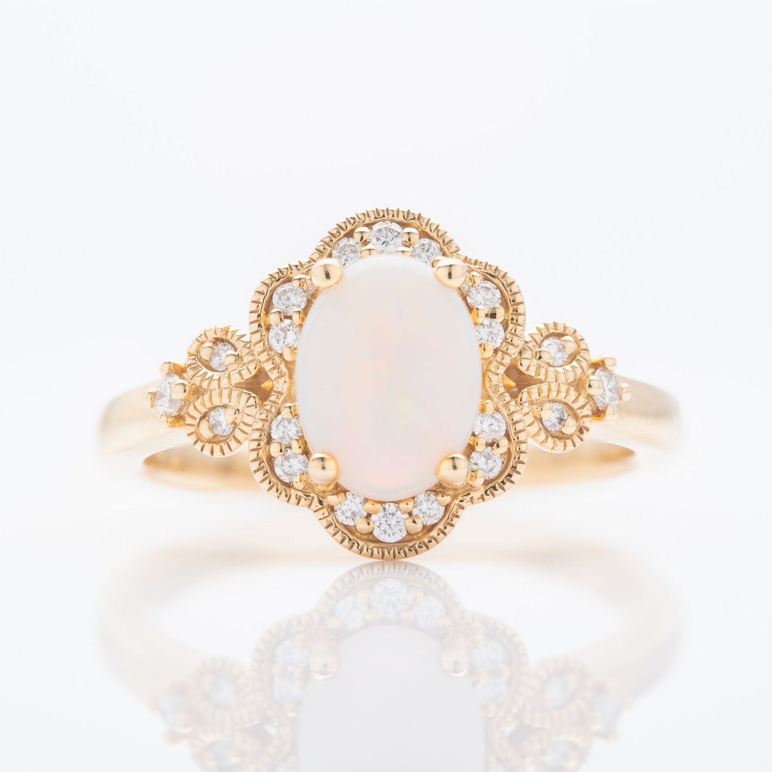 18ct Yellow Gold Oval Cut Opal and Brilliant Cut Diamond Ring 18ct Yellow Gold Oval Cut Opal and Brilliant Cut Diamond Ring