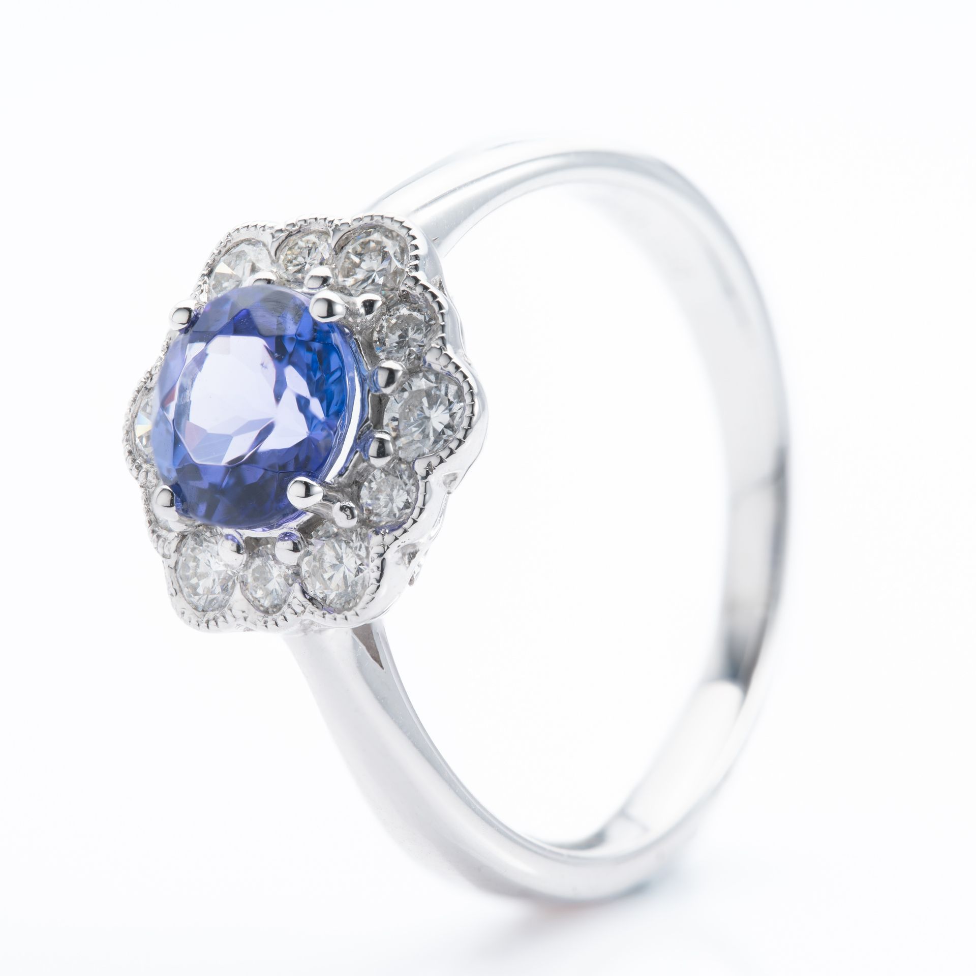 Platinum Round Cut Tanzanite & Round Brilliant Cut Diamond Cluster Ring