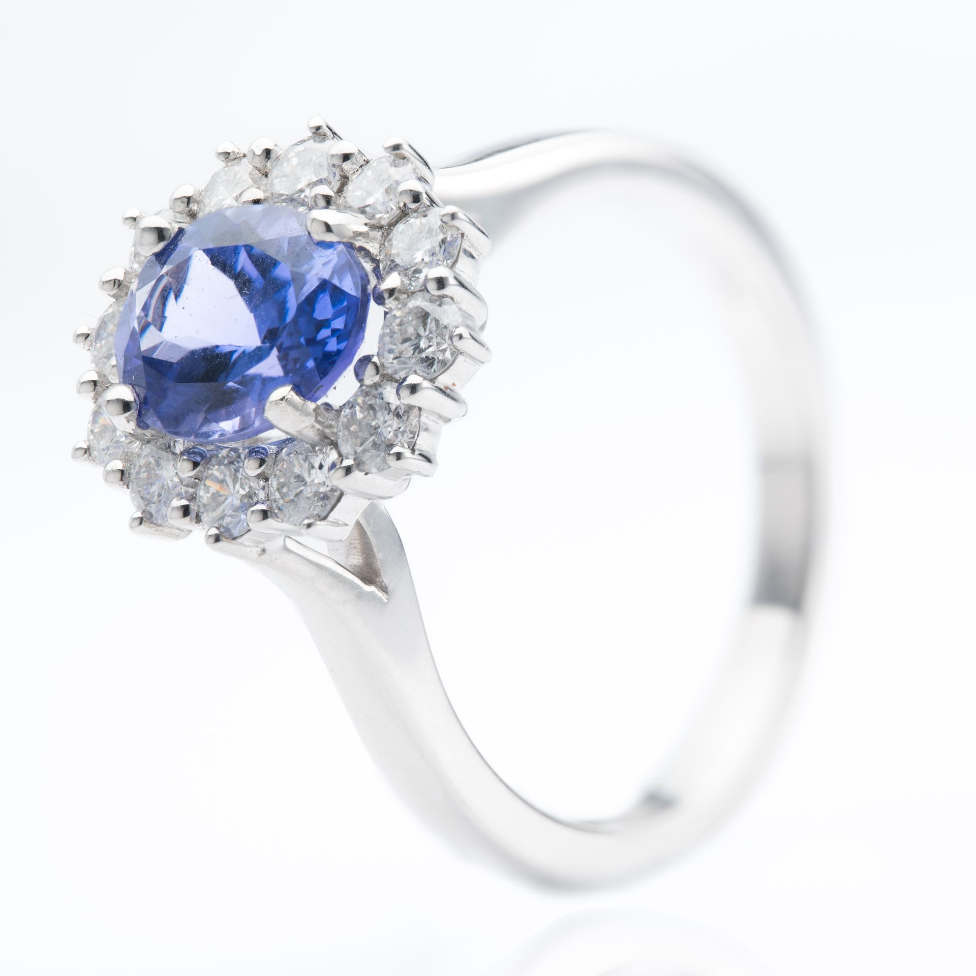 Platinum Oval Cut Tanzanite & Round Brilliant Cut Diamond Cluster Ring