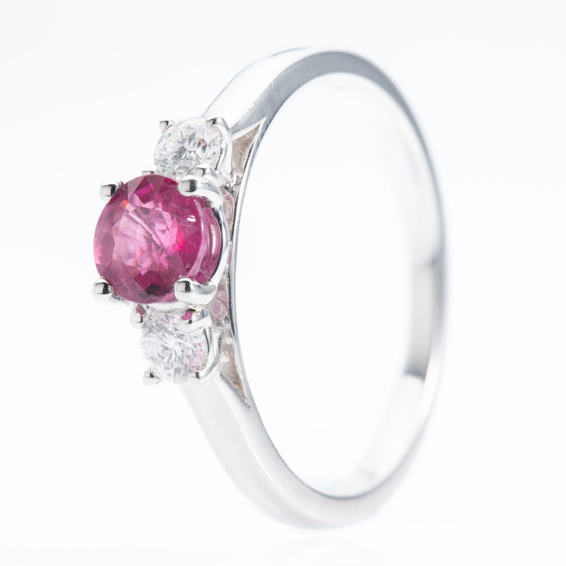 Platinum Round Cut Ruby and Brilliant Cut Diamond Trilogy Ring