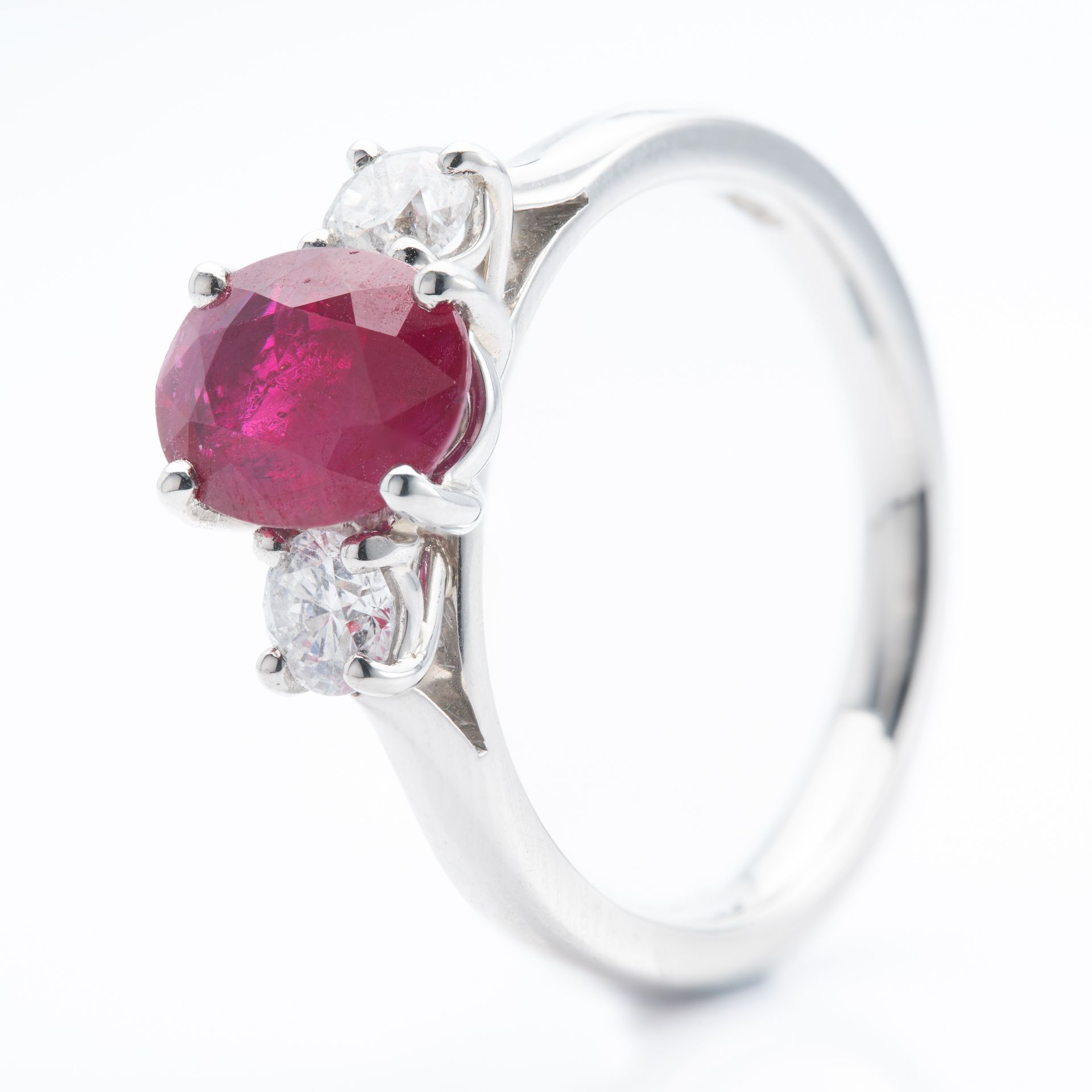 Platinum Oval Cut Ruby and Round Brilliant Cut Diamond Trilogy Ring