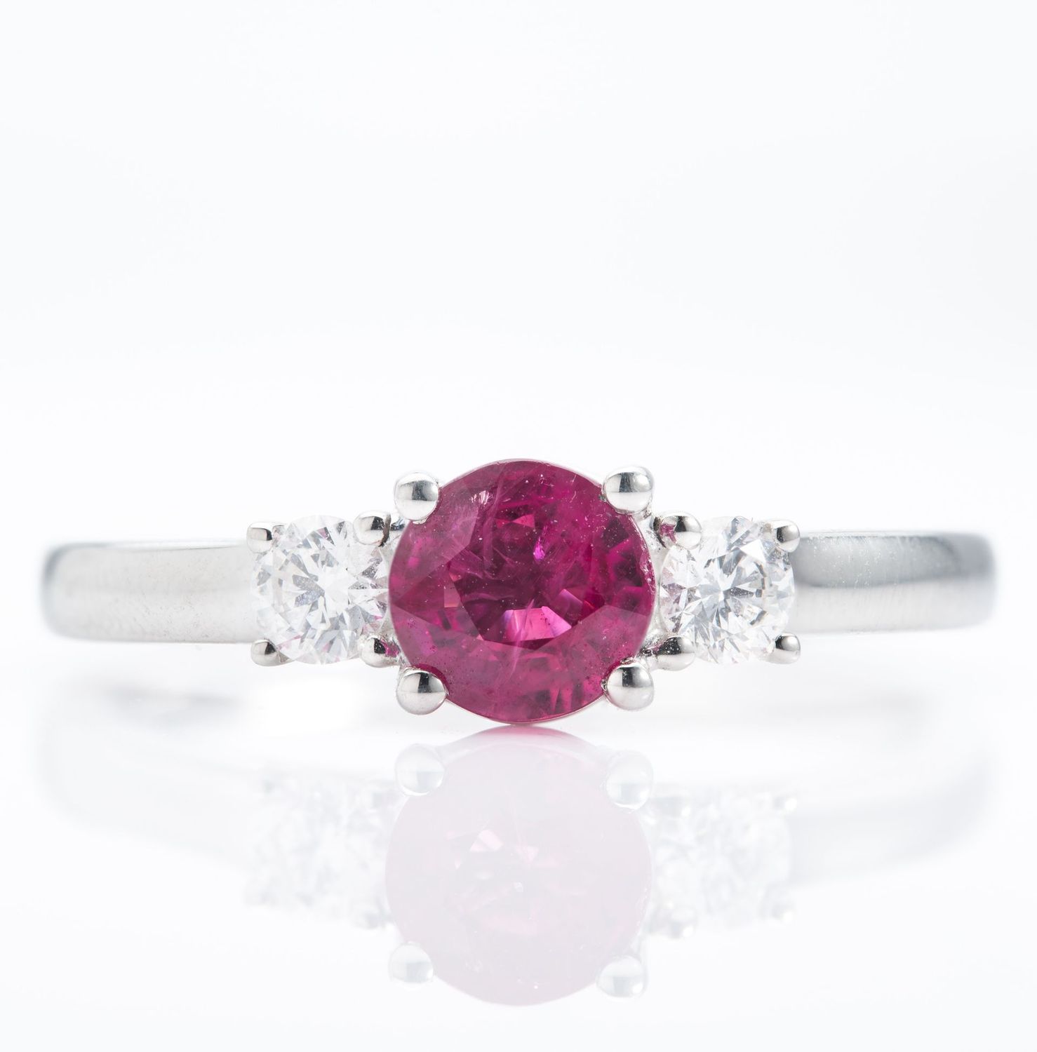 Platinum Round Cut Ruby and Brilliant Cut Diamond Trilogy Ring