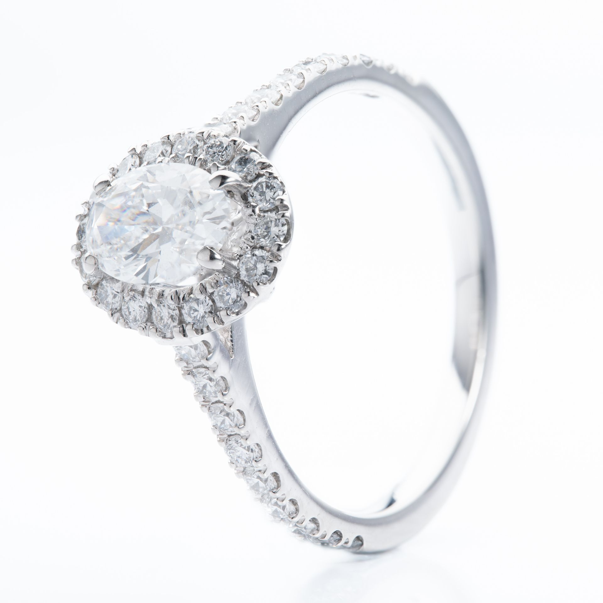 Platinum & Oval and Brilliant Cut Diamond Halo Cluster Ring