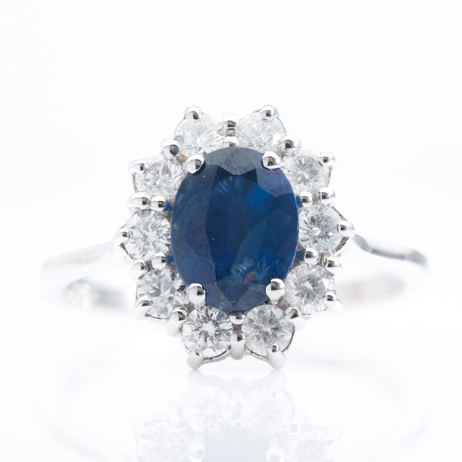 18ct White Gold Oval Cut Sapphire & Brilliant Cut Diamond Cluster Ring