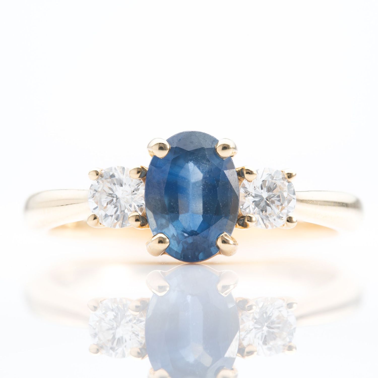 18ct Yellow Gold Oval Cut Sapphire & Brilliant Cut Diamond Trilogy Ring 18ct Yellow Gold Oval Cut Sapphire & Brilliant Cut Diamond Trilogy Ring