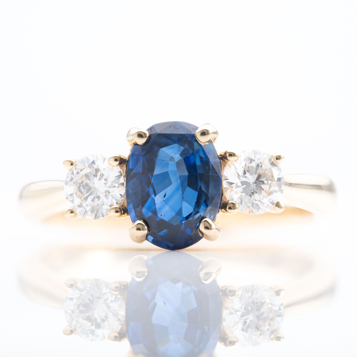 18ct Yellow Gold Oval Cut Sapphire and Brilliant Cut Diamond Trilogy Ring 18ct Yellow Gold Oval Cut Sapphire and Brilliant Cut Diamond Trilogy Ring