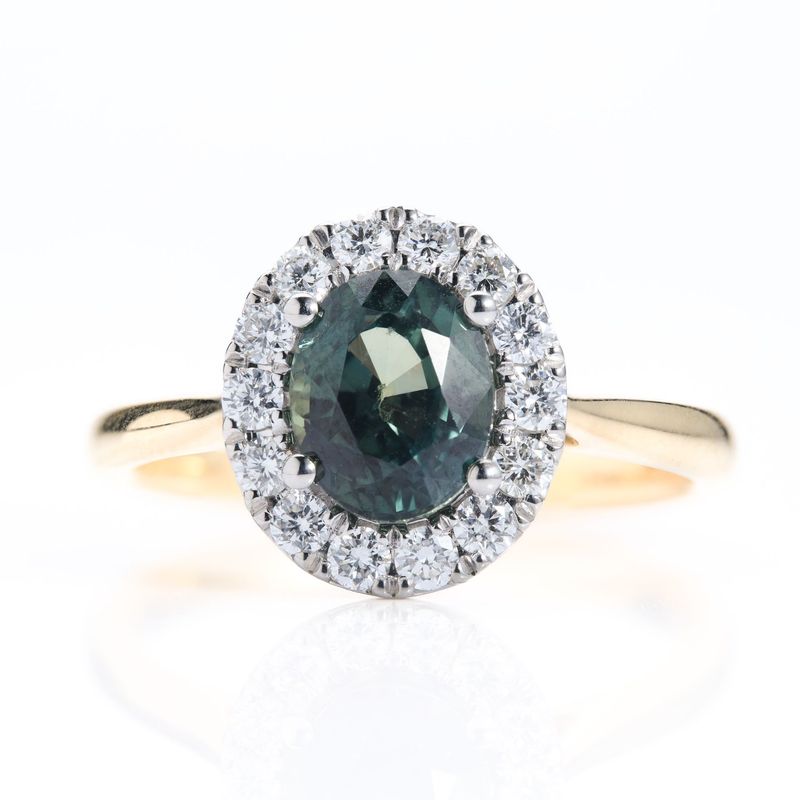 18ct Yellow Gold & Platinum Oval Cut Teal Green Sapphire & Round Brilliant Cut Diamond Halo Cluster Ring