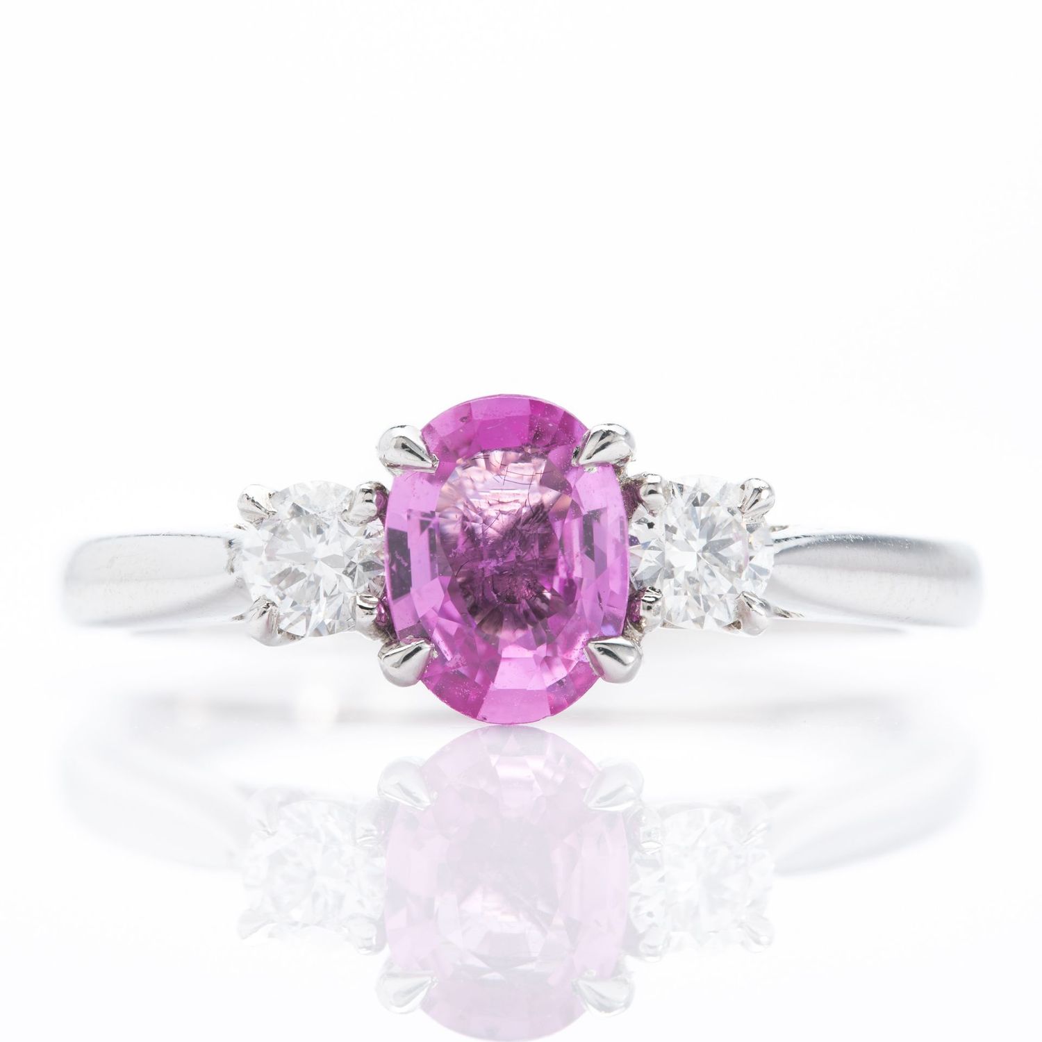 Platinum Oval Cut Pink Sapphire & Round Brilliant Cut Diamond Trilogy Ring