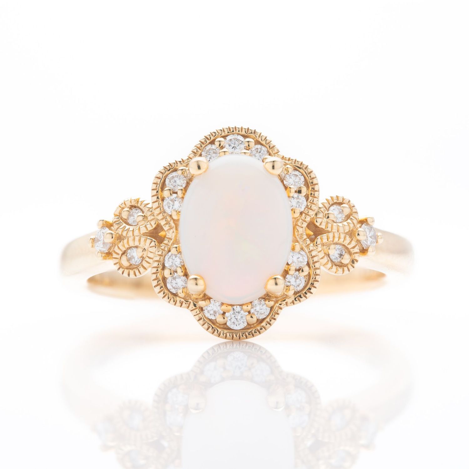 18ct Yellow Gold Oval Cut Opal and Brilliant Cut Diamond Ring