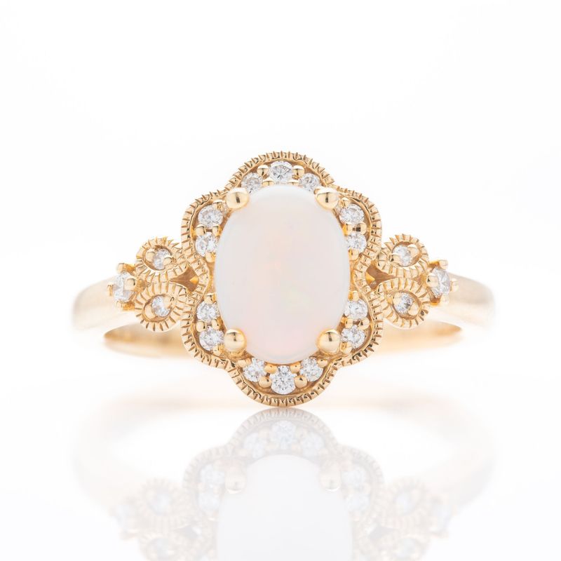 18ct Yellow Gold Oval Cut Opal and Brilliant Cut Diamond Ring
