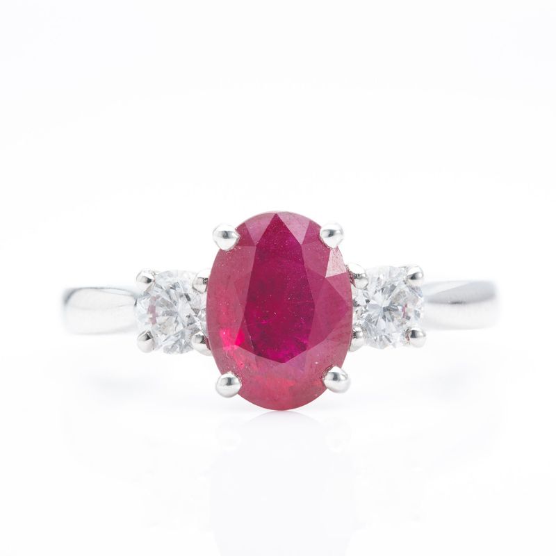Platinum Oval Cut Ruby and Round Brilliant Cut Diamond Trilogy Ring