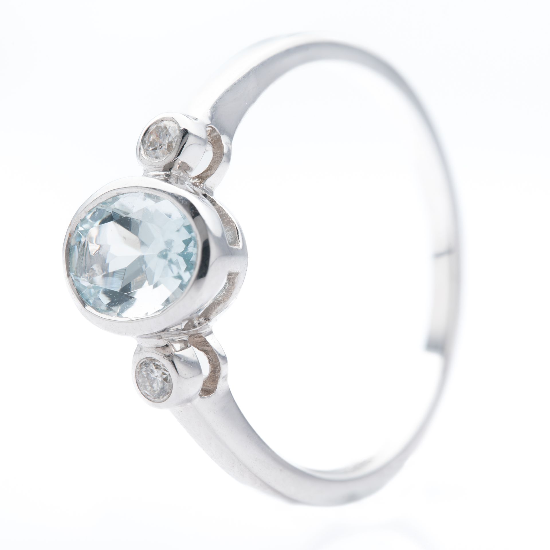 9ct White Gold Oval Cut Aquamarine & Round Brilliant Cut Diamond Rubover Set Trilogy Ring