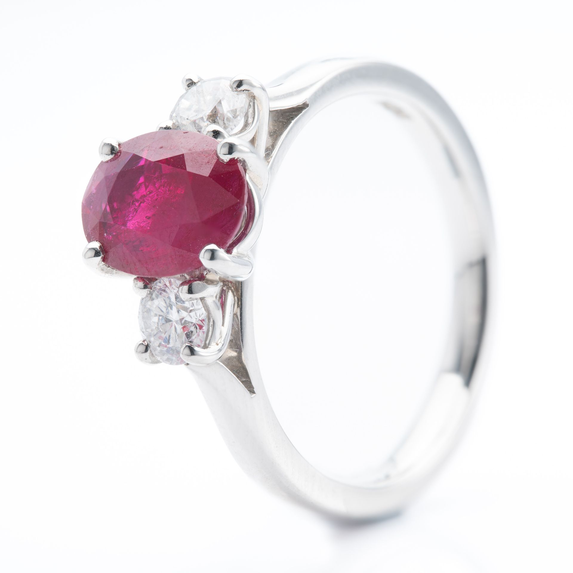 Platinum Oval Cut Ruby and Round Brilliant Cut Diamond Trilogy Ring