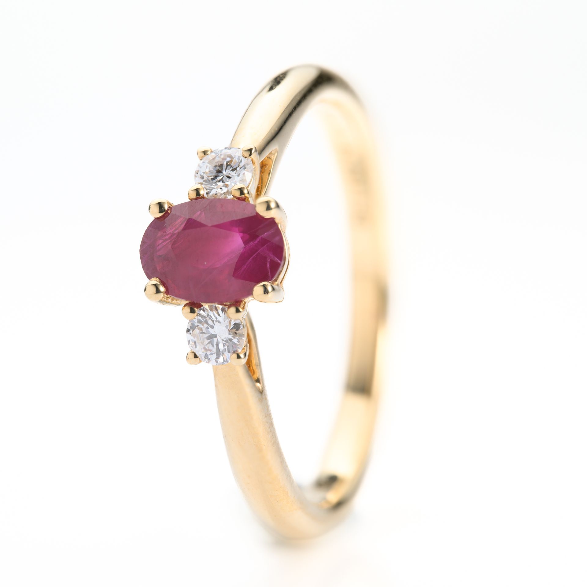 18ct Yellow Gold Oval Cut Ruby & Round Brilliant Cut Diamond Trilogy Ring