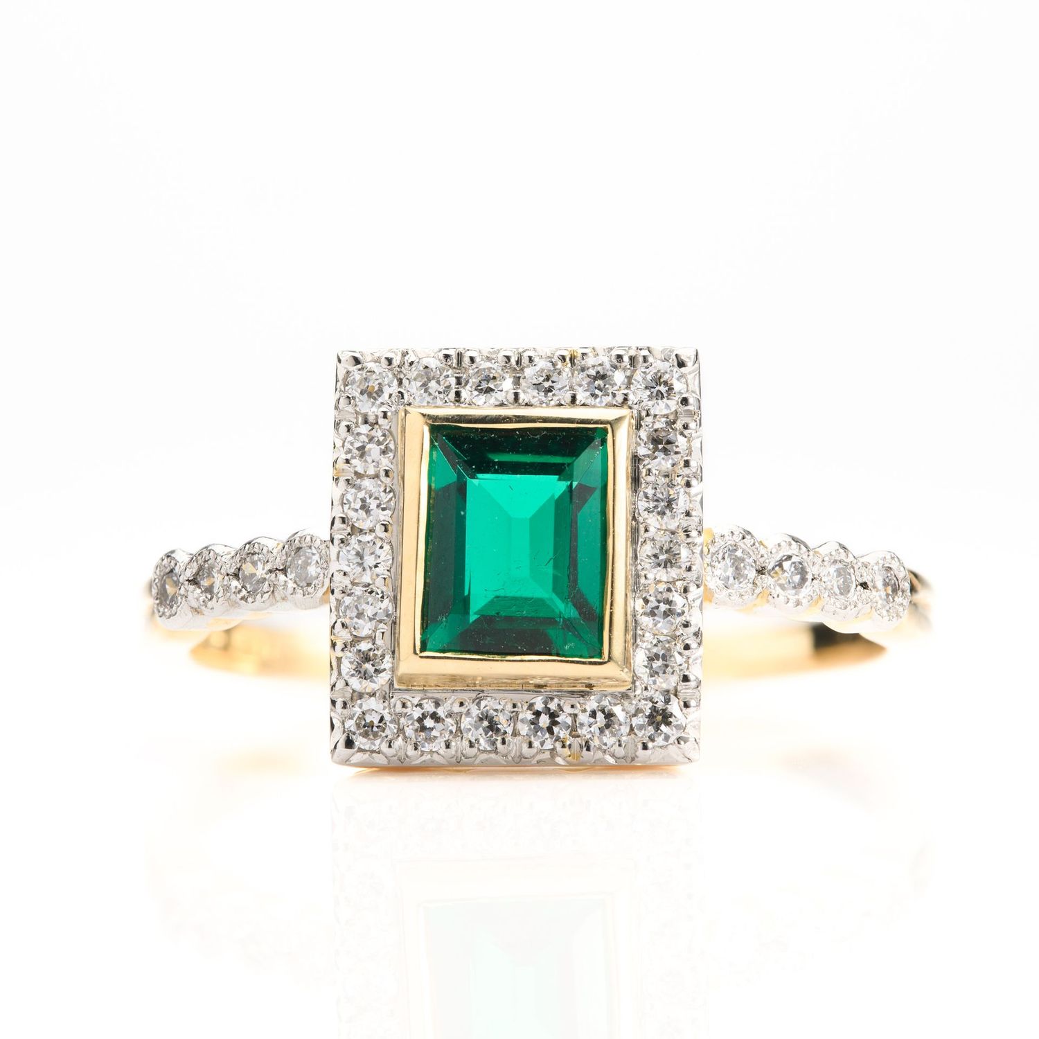 18ct Yellow Gold & Platinum Rectangular Cut Emerald & Round Brilliant Cut Diamond Halo Cluster Ring