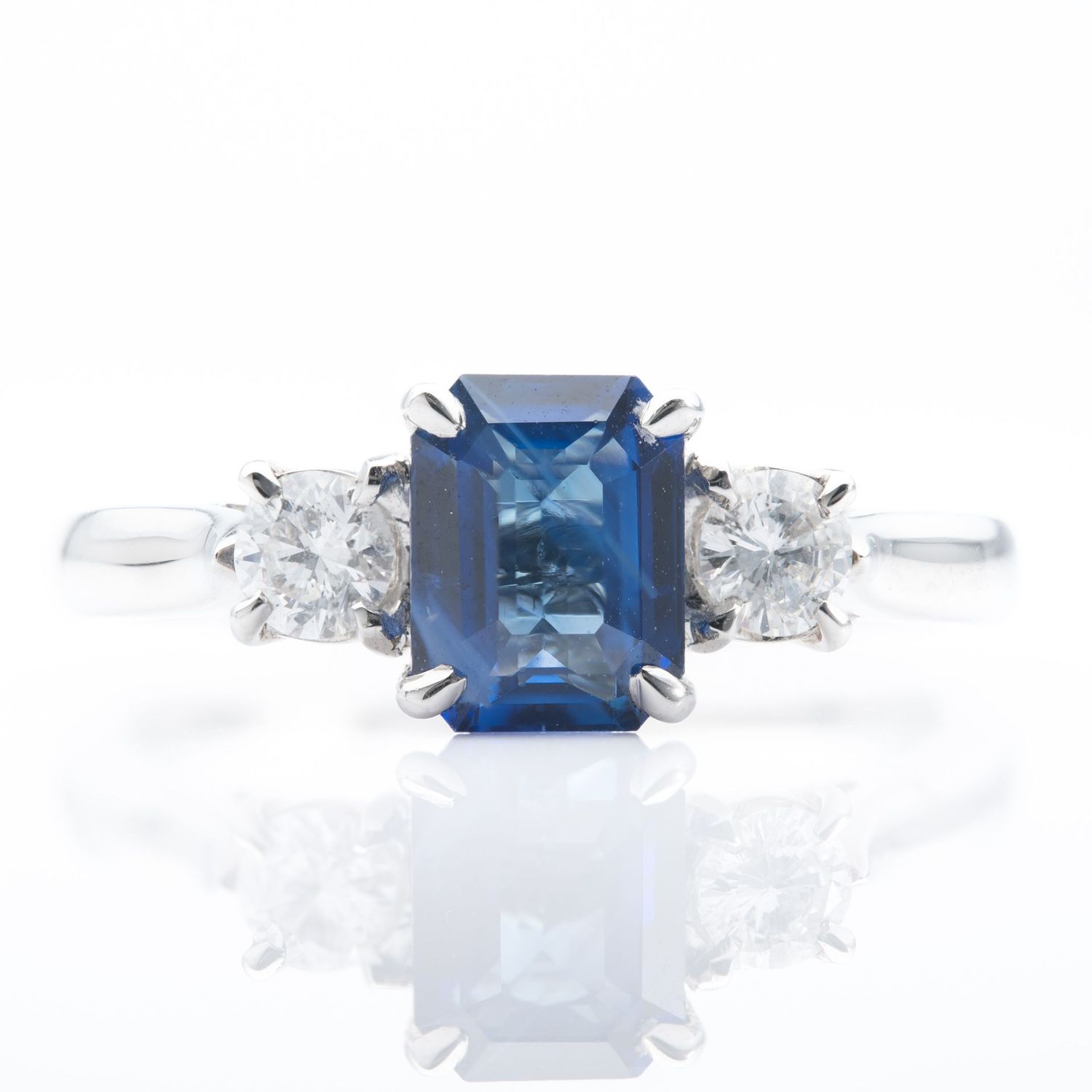 Platinum Emerald cut Sapphire and Diamond Trilogy Ring