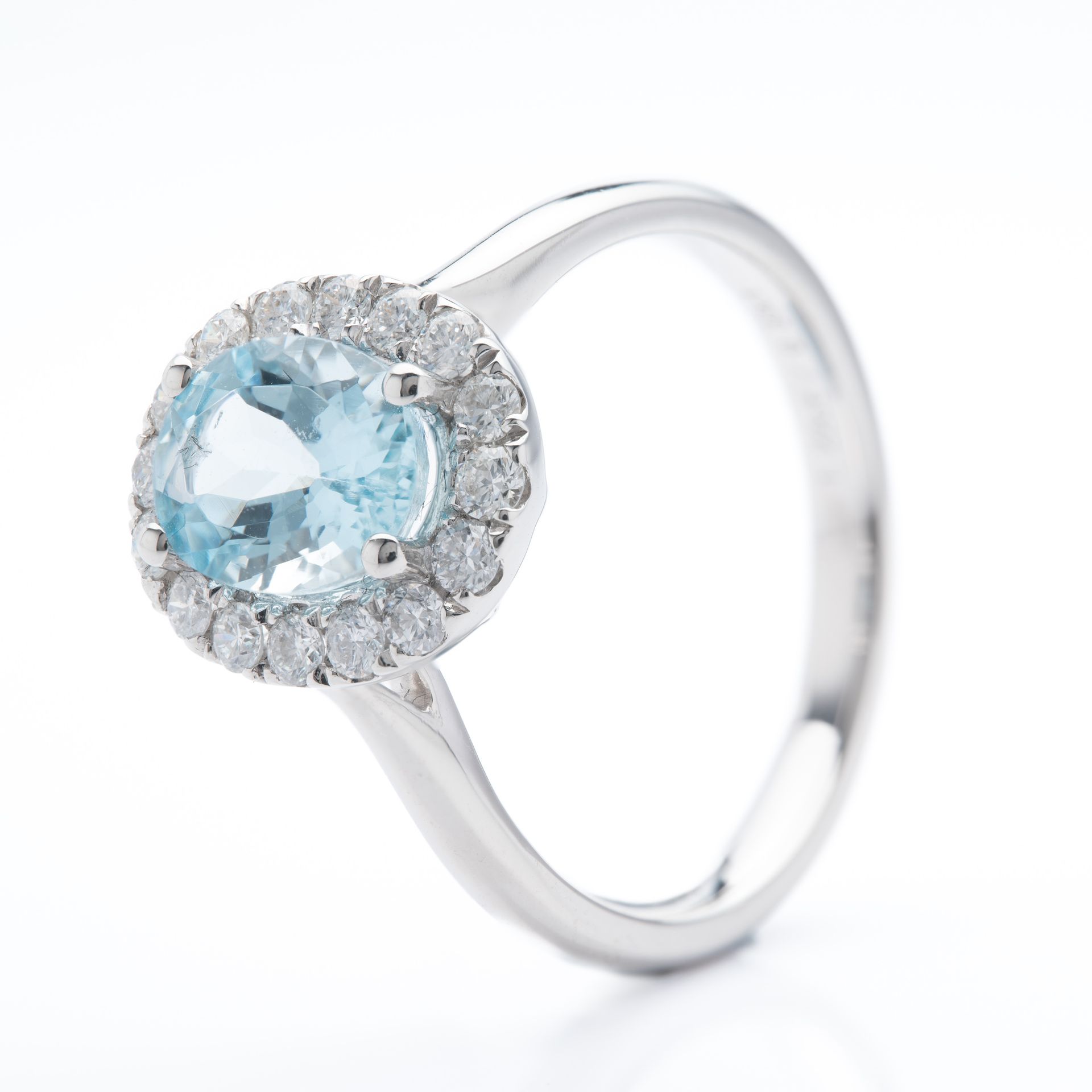 Platinum Oval Cut Aquamarine and Brilliant Cut Diamond Cluster Ring