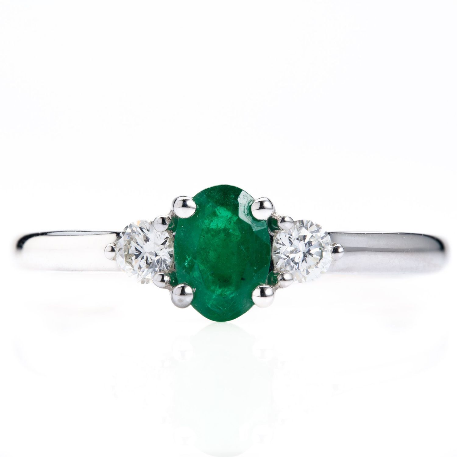 Platinum Oval Cut Emerald & Round Brilliant Cut Diamond Trilogy Ring Platinum Oval Cut Emerald & Round Brilliant Cut Diamond Trilogy Ring