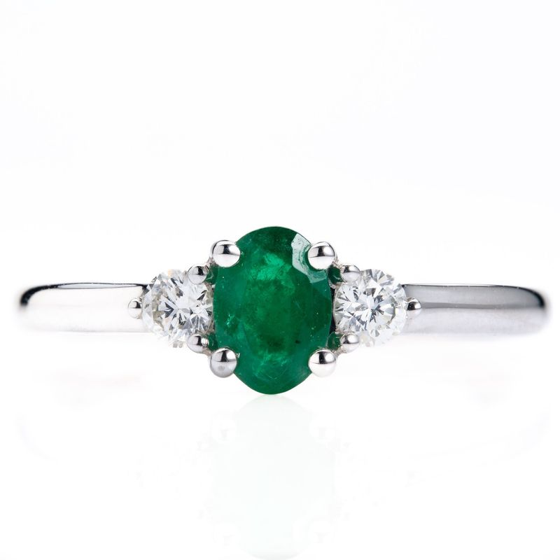Platinum Oval Cut Emerald & Round Brilliant Cut Diamond Trilogy Ring