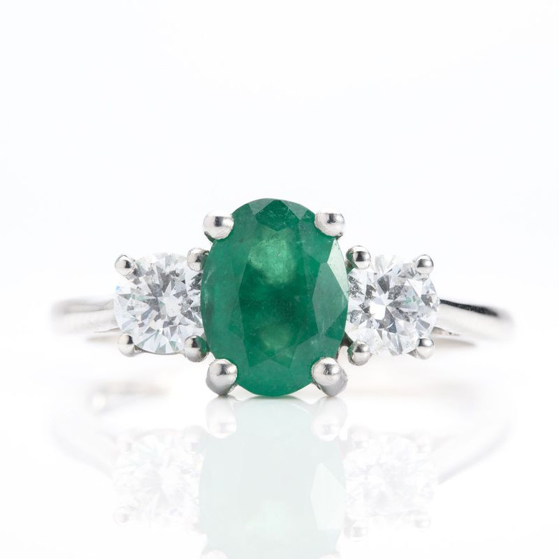 Platinum Oval Cut Emerald & Round Brilliant Cut Diamond Trilogy Ring