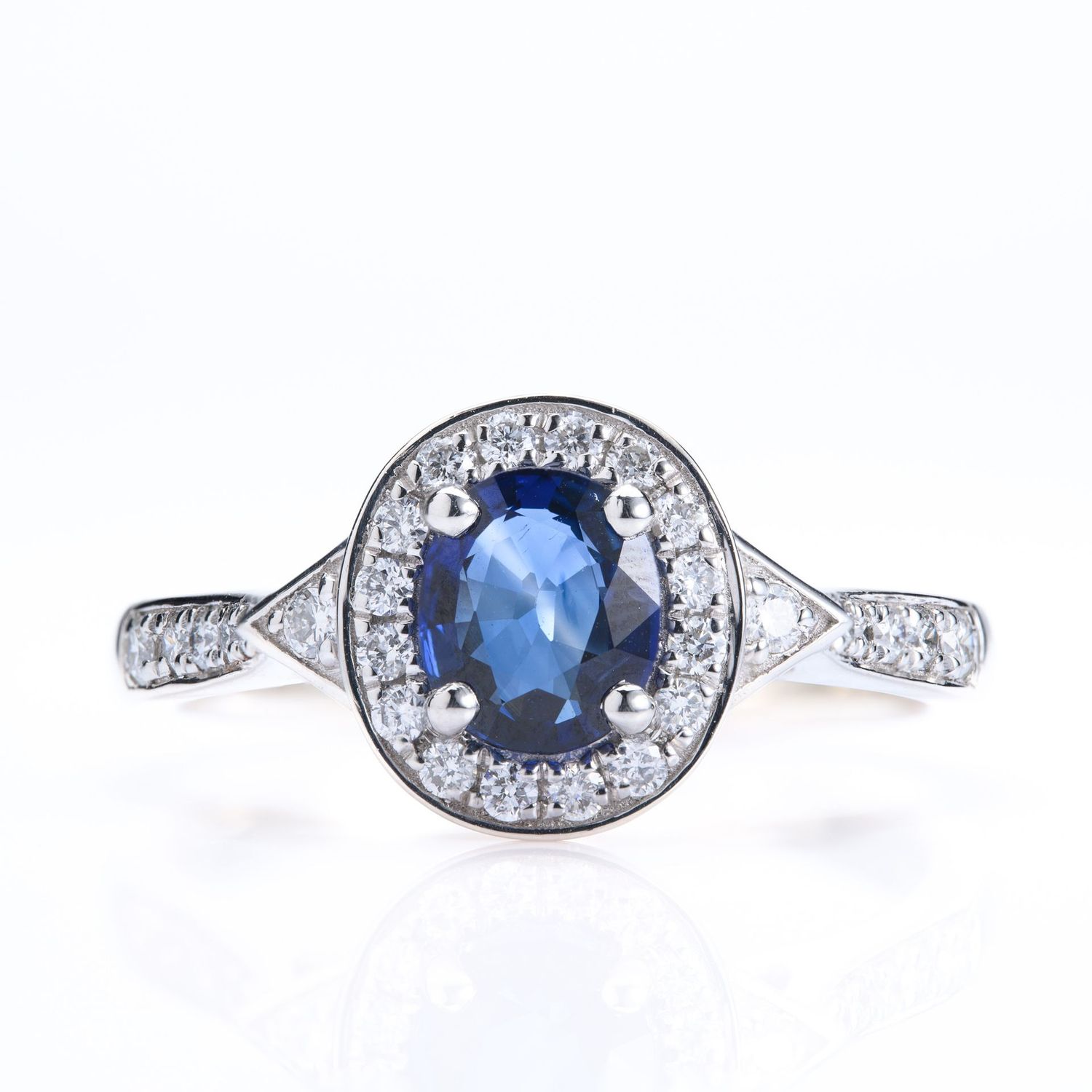 Platinum Oval Cut Sapphire & Round Brilliant Cut Diamond Halo Cluster Ring