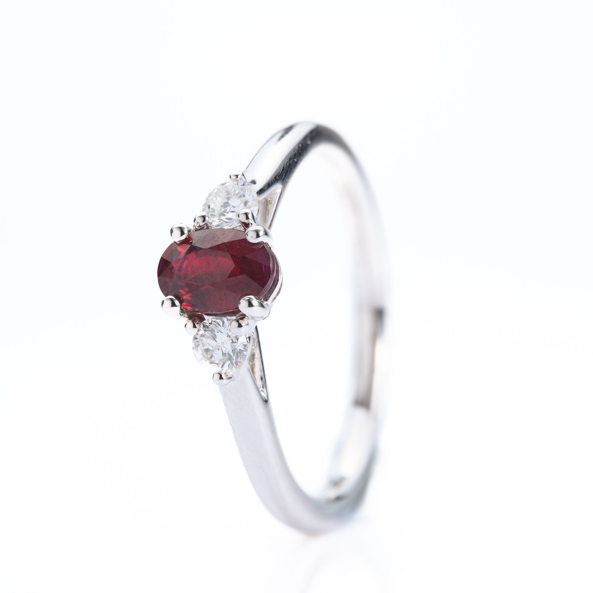 Platinum Oval Cut Ruby & Round Brilliant Cut Diamond Trilogy Ring