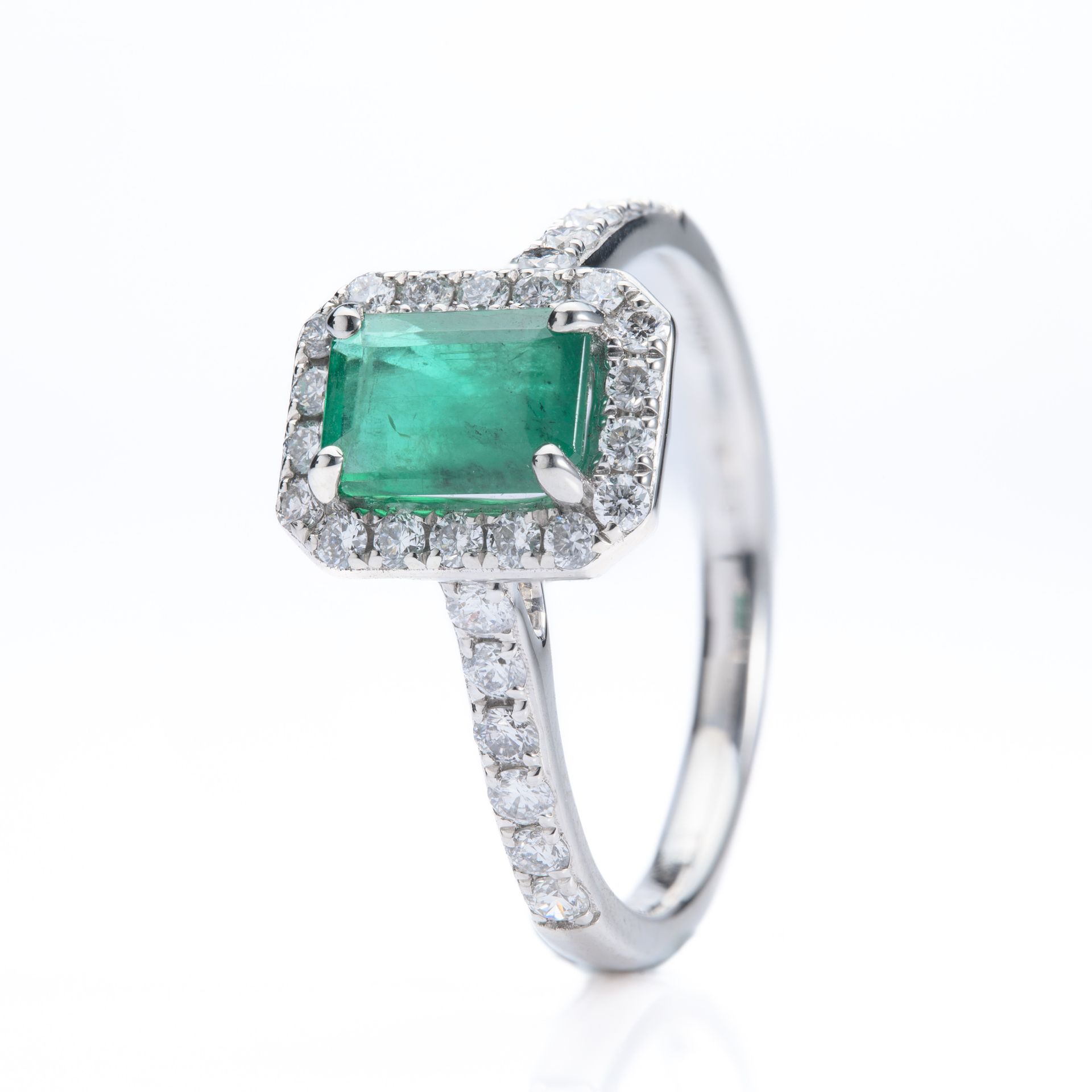 Platinum Rectangular Cut Emerald & Round Brilliant Cut Diamond Halo Cluster Ring with Diamond Shoulders