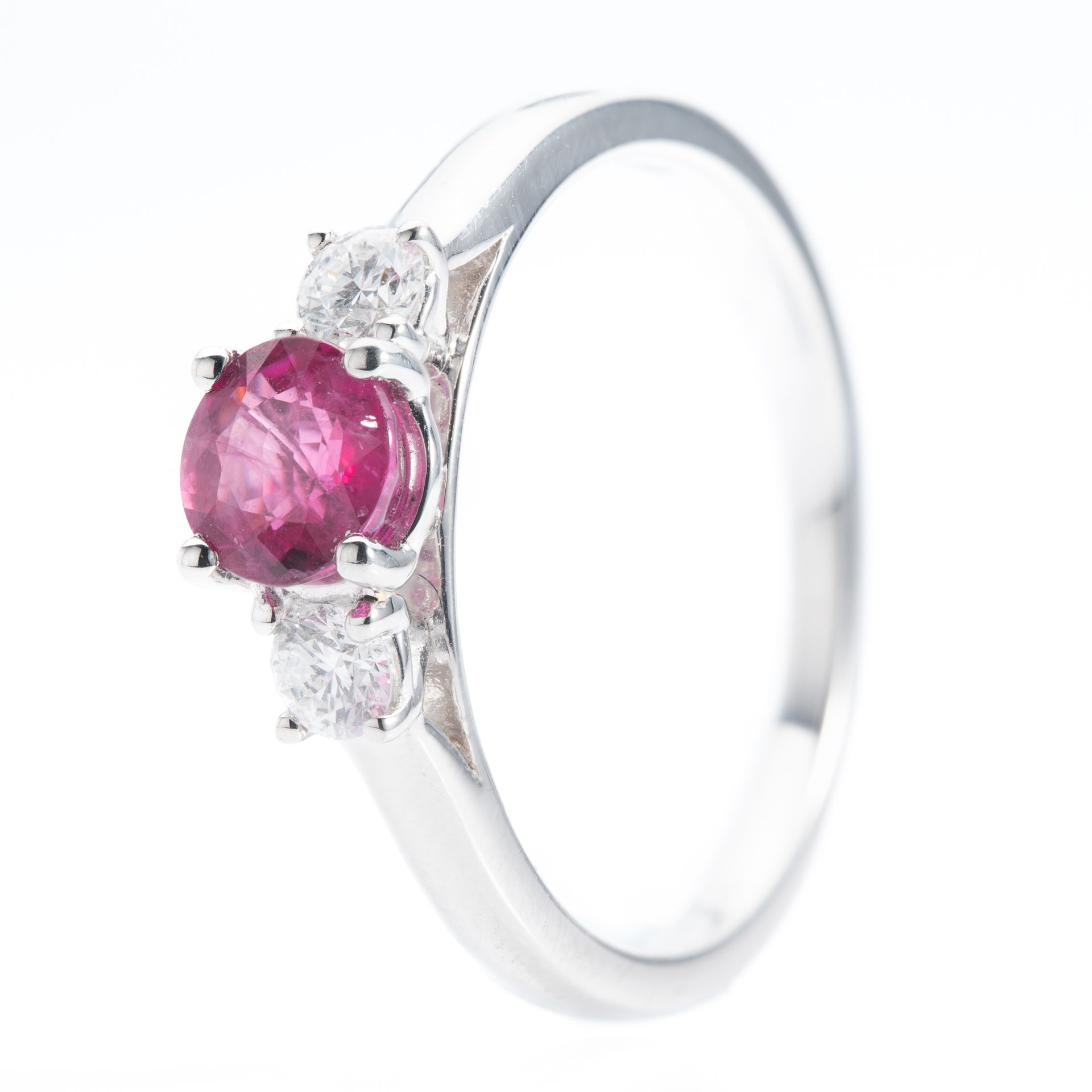 Platinum Round Cut Ruby and Brilliant Cut Diamond Trilogy Ring