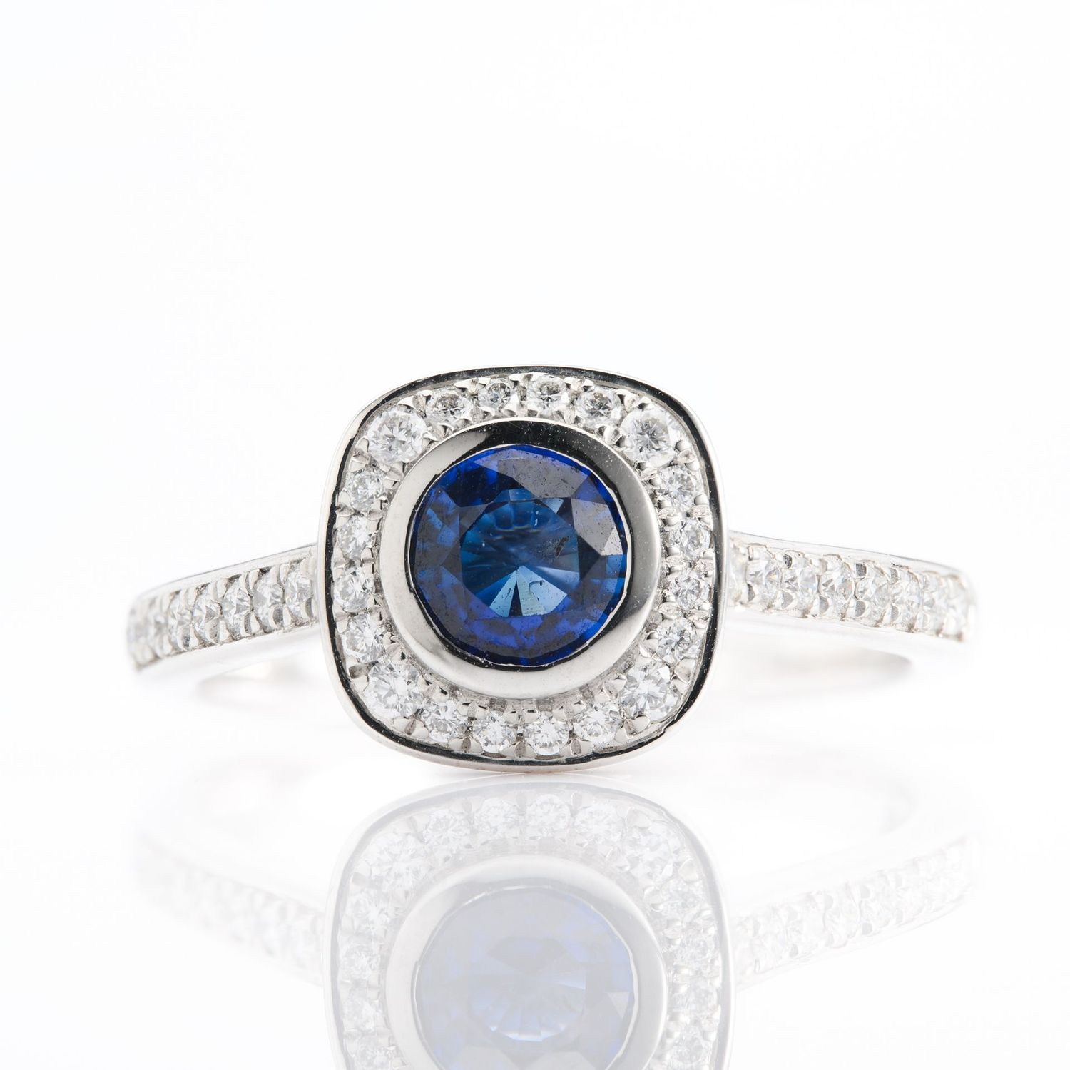 Platinum Round Cut Sapphire and Round Brilliant Cut Diamond Halo Ring Platinum Round Cut Sapphire and Round Brilliant Cut Diamond Halo Ring