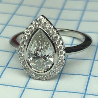 Pear Shape Diamond Halo Engagement Ring in Platinum