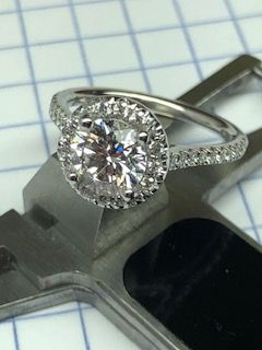 Round Diamond Halo Engagement Ring in Platinum