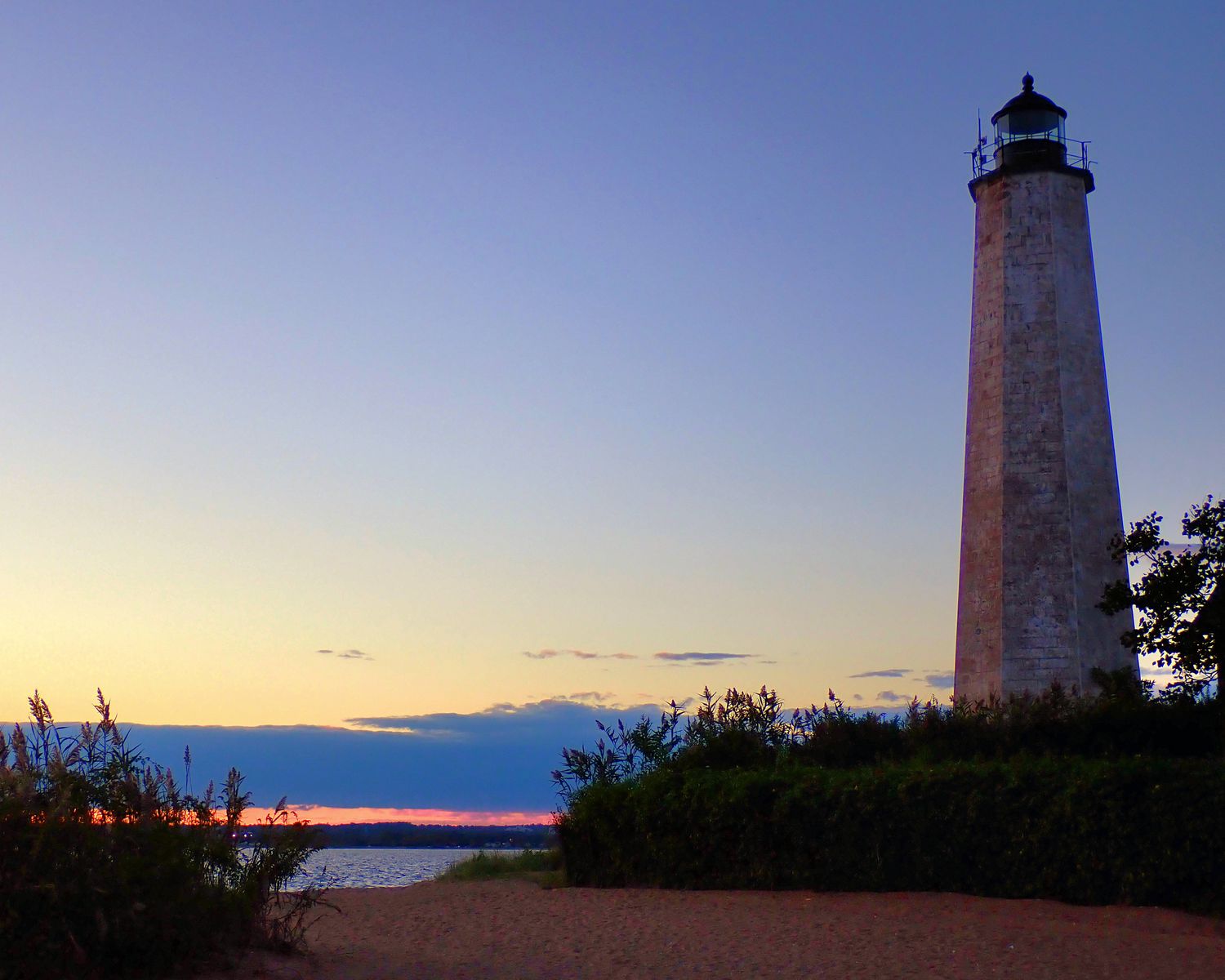 Lighthouse at Sunset, 8 x 12 Framed in Natural Wood