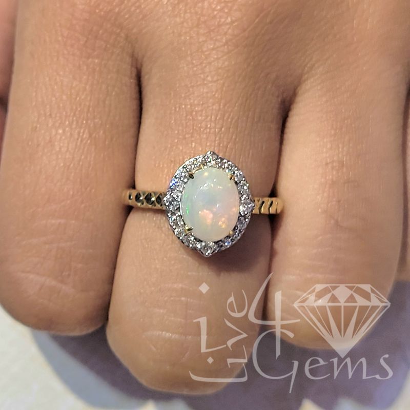 10kt 1/5ctw Diamond Halo Oval Opal Ring